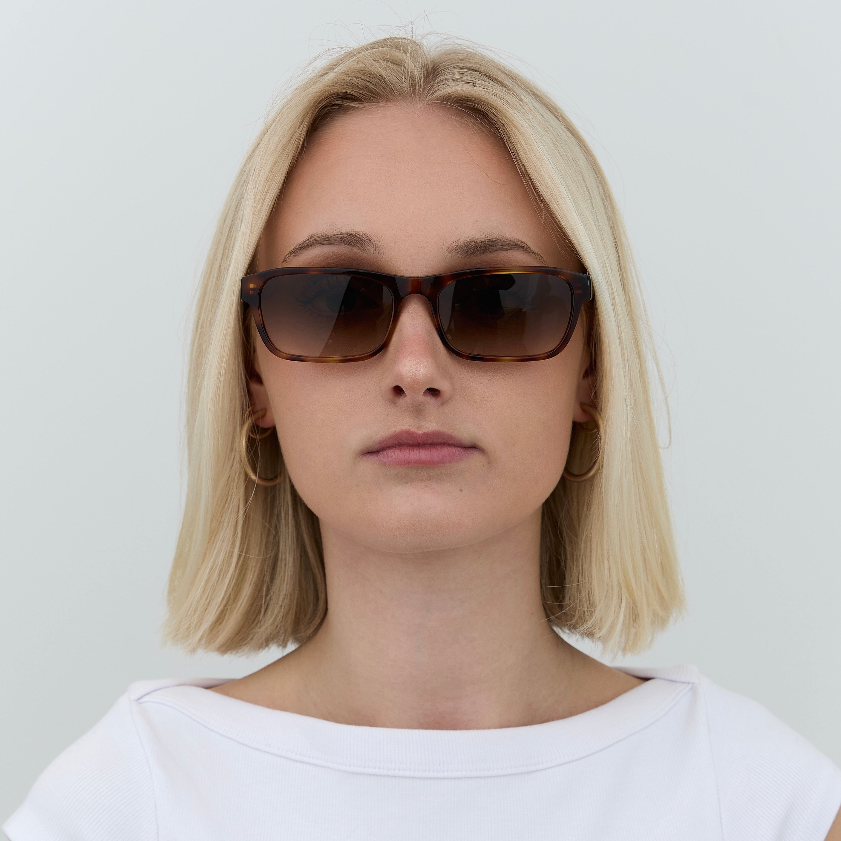 Front view of woman wearing Latiner sunglasses in tortoiseshell.