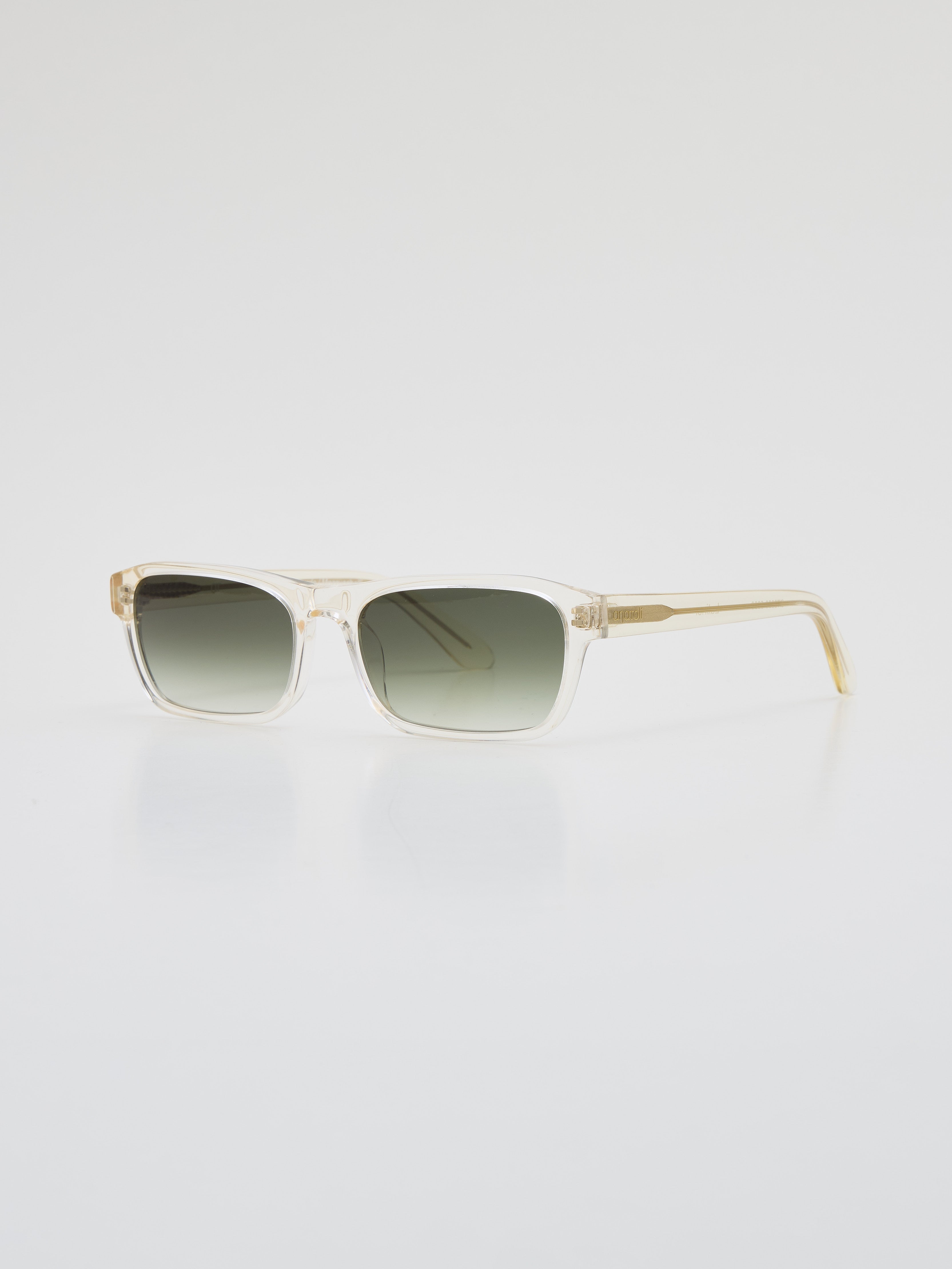 Latiner sunglasses in Transparent Yellow acetate with green gradient lenses, angled side-front view