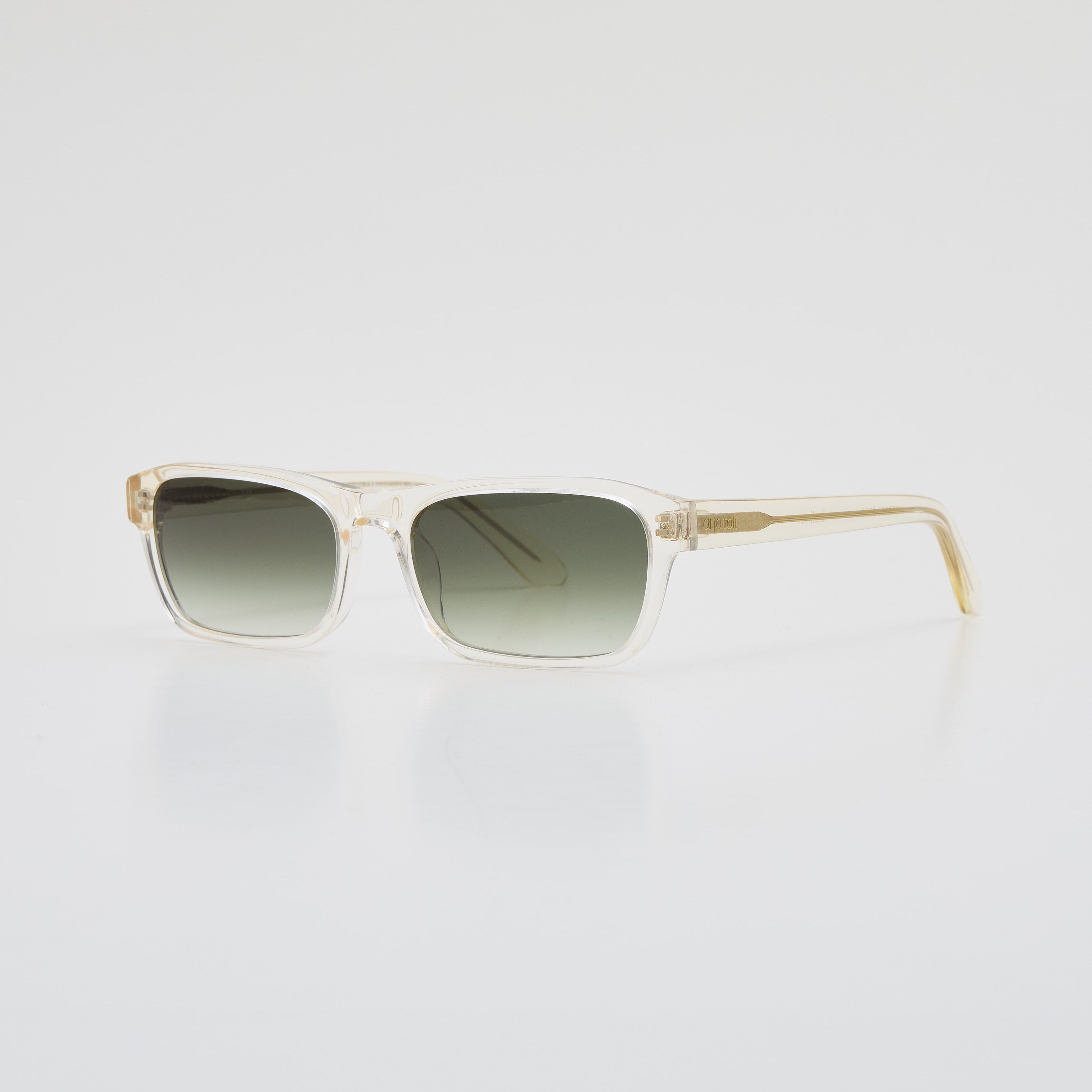 Latiner sunglasses in Transparent Yellow acetate with green gradient lenses, angled side-front view